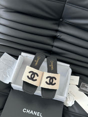 WOVEN SLIDE IN RAFFIA AND BLACK LAMBSKIN