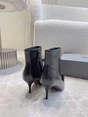 POINTED-TOE HIGH HEEL BOOTS IN BLACK LIZARD EMBOSSED CALFSKIN