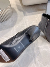 POINTED-TOE HIGH HEEL BOOTS IN BLACK LIZARD EMBOSSED CALFSKIN