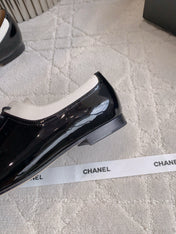 CHANEL 25S TWO TONE LACE UP IN BLACK AND WHITE SHINY CALFSKIN