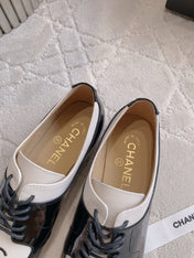 CHANEL 25S TWO TONE LACE UP IN BLACK AND WHITE SHINY CALFSKIN