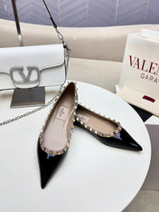 ROCKSTUD FLAT PUMP IN BLACK CALFSKIN