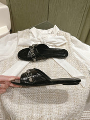 CAGOLE FLAT SANDALS IN BLACK WAX-OIL SHEEPSKIN