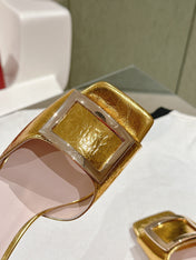 TRUMPET METALLIC MULES IN GOLD PATENT CALFSKIN