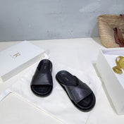 THE ROW 26S CROSS STRAP SLIDES IN BLACK CALFSKIN