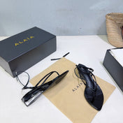 ALAIA 26S THONG SANDALS IN BLACK CALFSKIN