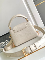 CAPUCINES MINI 21 IN PEARL WHITE TAURILLON GOLD HARDWARE