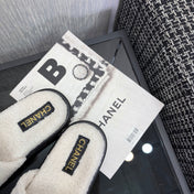 CHANEL 26S SLIDE SANDALS  IN BLACK AND WHITE SHEARLING