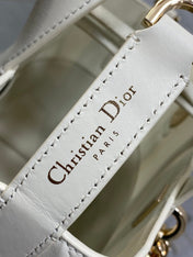 DIOR 25S TOUJOURS VERTICAL TOTE BAG 18 IN IVORY CALFSKIN WITH CHARM BRACELET STRAP