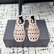ALAIA 26S FLAT SLIP-ONS IN NUDE PINK SUEDE WITH OPENWORK PATTERN