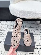 ALAIA 26S FLAT SLIP-ONS IN NUDE PINK SUEDE WITH OPENWORK PATTERN