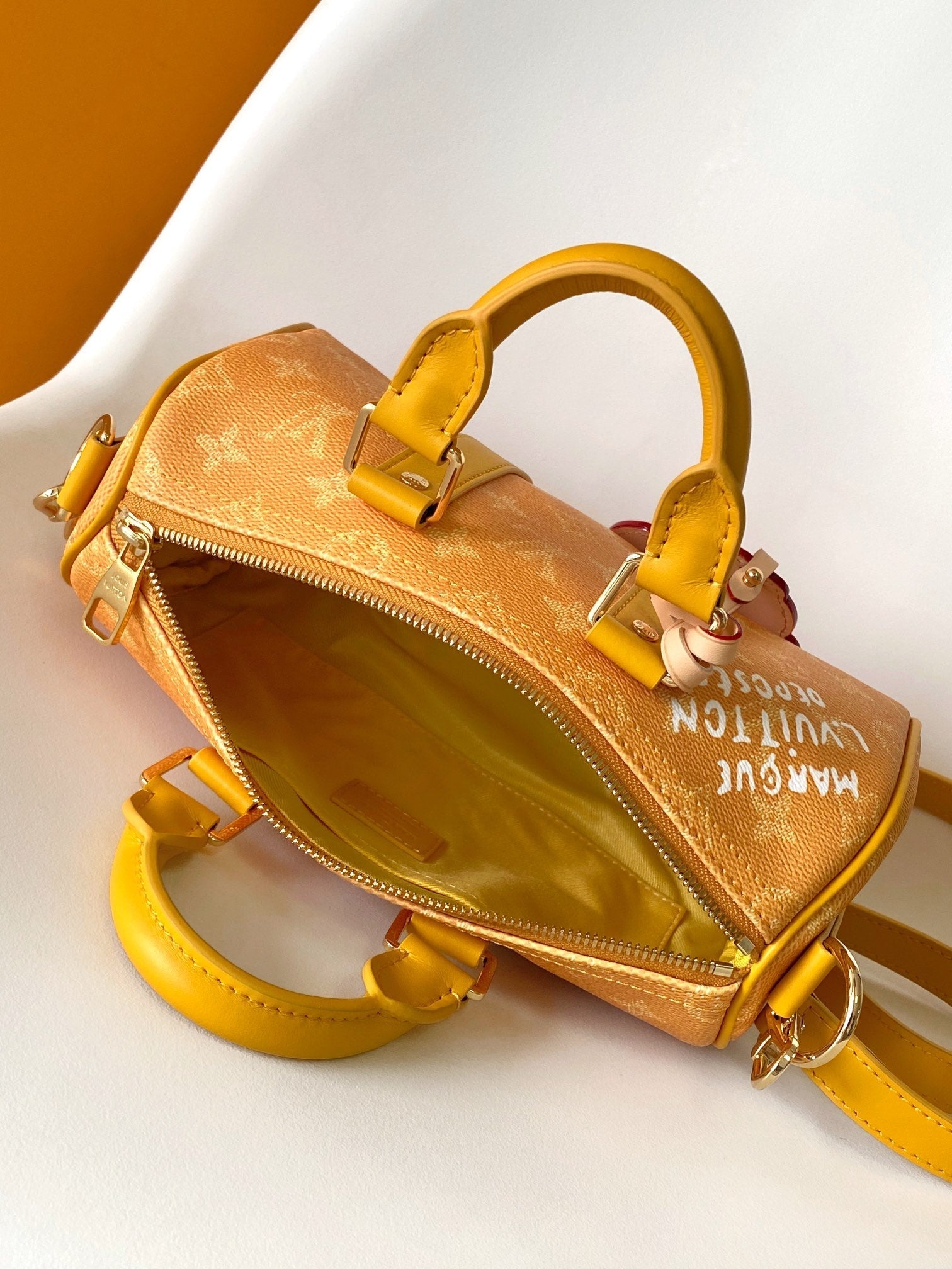 KEEPALL BANDOULIÈRE 25 IN ORANGE MONOGRAM HERITAGE CANVAS