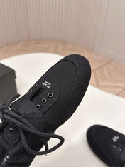 PRADA 26S LACE UP MINIMAL SNEAKERS IN BLACK CANVAS