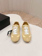 PRADA 26S SNEAKERS IN YELLOW QUILTED NYLON AND SUEDE