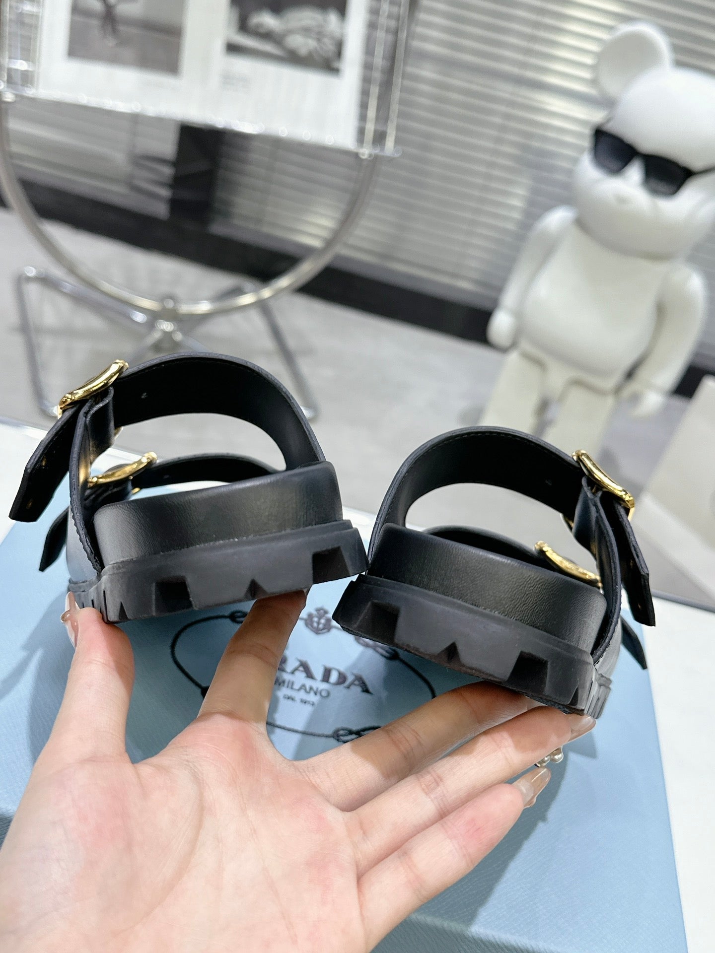 PRADA 25S STRAP SLIDES 30MM IN BLACK CALFSKIN GOLD HARDWARE
