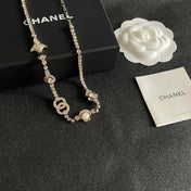 CHANEL 26S DOUBLE C LOGO CRYSTAL MULTI-CHARM STATEMENT BRACELET IN GOLD METAL 629170