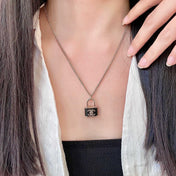CHANEL 26S DOUBLE C LOGO PADLOCK CHAIN NECKLACE IN GOLD & BLACK METAL 629974