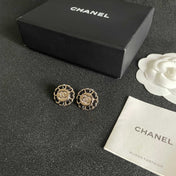CHANEL 26S DOUBLE C LOGO BLACK ENAMEL FLORAL STUD EARRINGS IN GOLD METAL 629992