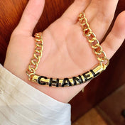 CHANEL 26S CHANEL BLACK LETTER LOGO CHAIN NECKLACE IN GOLD METAL 630061