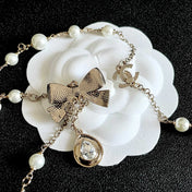 CHANEL 26S DOUBLE C LOGO PEARL LAYERED CHAIN BOW & CRYSTAL DROP NECKLACE IN GOLD METAL 629883
