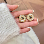 CHANEL 26S DOUBLE C LOGO PEARL ROUND STUD EARRINGS IN GOLD METAL 629906