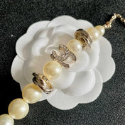 CHANEL 26S DOUBLE C LOGO PEARL BEADED BRACELET WITH CRYSTAL DETAIL IN GOLD METAL 631014