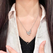 CHANEL 26S DOUBLE C LOGO CRYSTAL BOW & STAR PENDANT NECKLACE IN SILVER METAL 631019