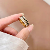 CD 26S CRYSTAL BAND LOGO RING IN GOLD TONE METAL 630811