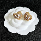 CHANEL 26S DOUBLE C LOGO PAVE HEART STUD EARRINGS WITH WHITE ENAMEL IN GOLD METAL 631815