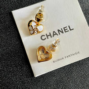 CHANEL 26S DOUBLE C HEART DROP EARRINGS WITH WHITE ENAMEL FLORAL DETAIL IN GOLD METAL 631910