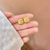CHANEL 26S CHANEL CC LOGO PAVE CRYSTAL STUD EARRINGS IN YELLOW ENAMEL WITH GOLD METAL 633311