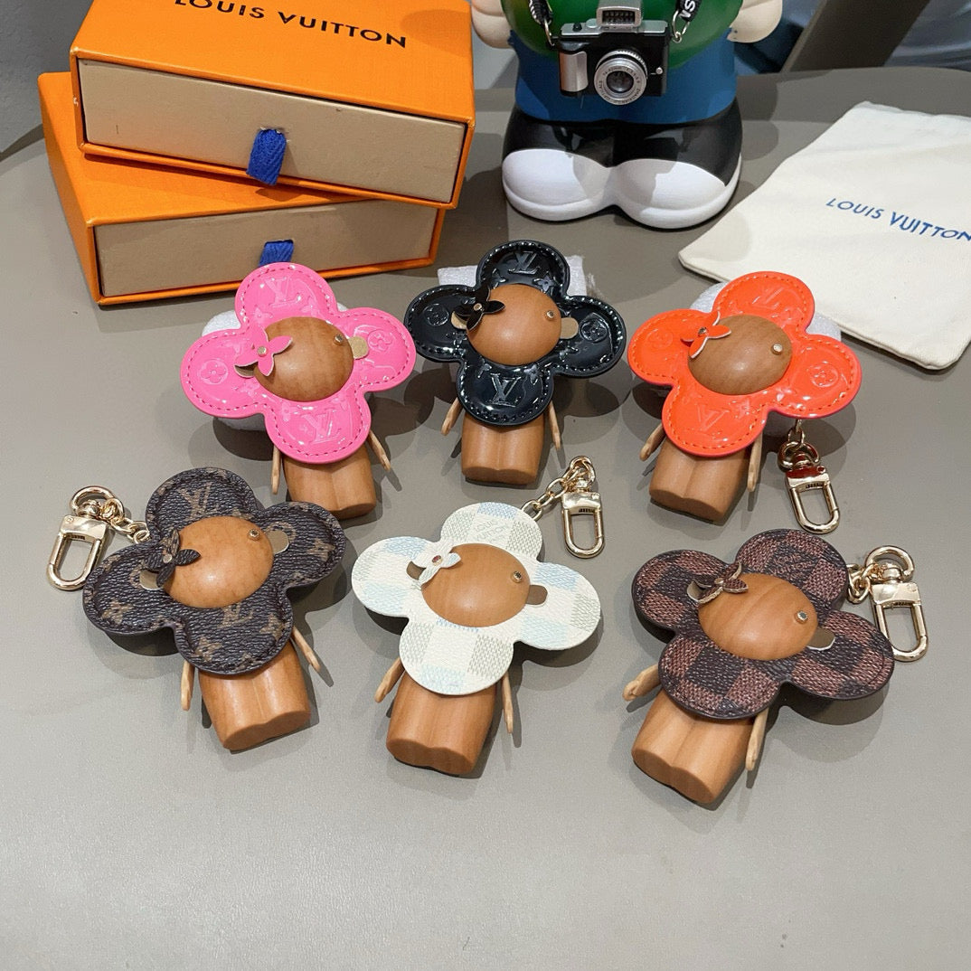LV KEYCHAIN IN BLACK CALFSKIN AND WOOD