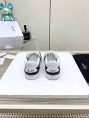 SNEAKER WITH TRIOMPHE IN BLACK AND WHITE CALFSKIN