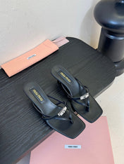 MIUMIU 26S LOW-HEEL THONG SANDALS IN BLACK CALFSKIN