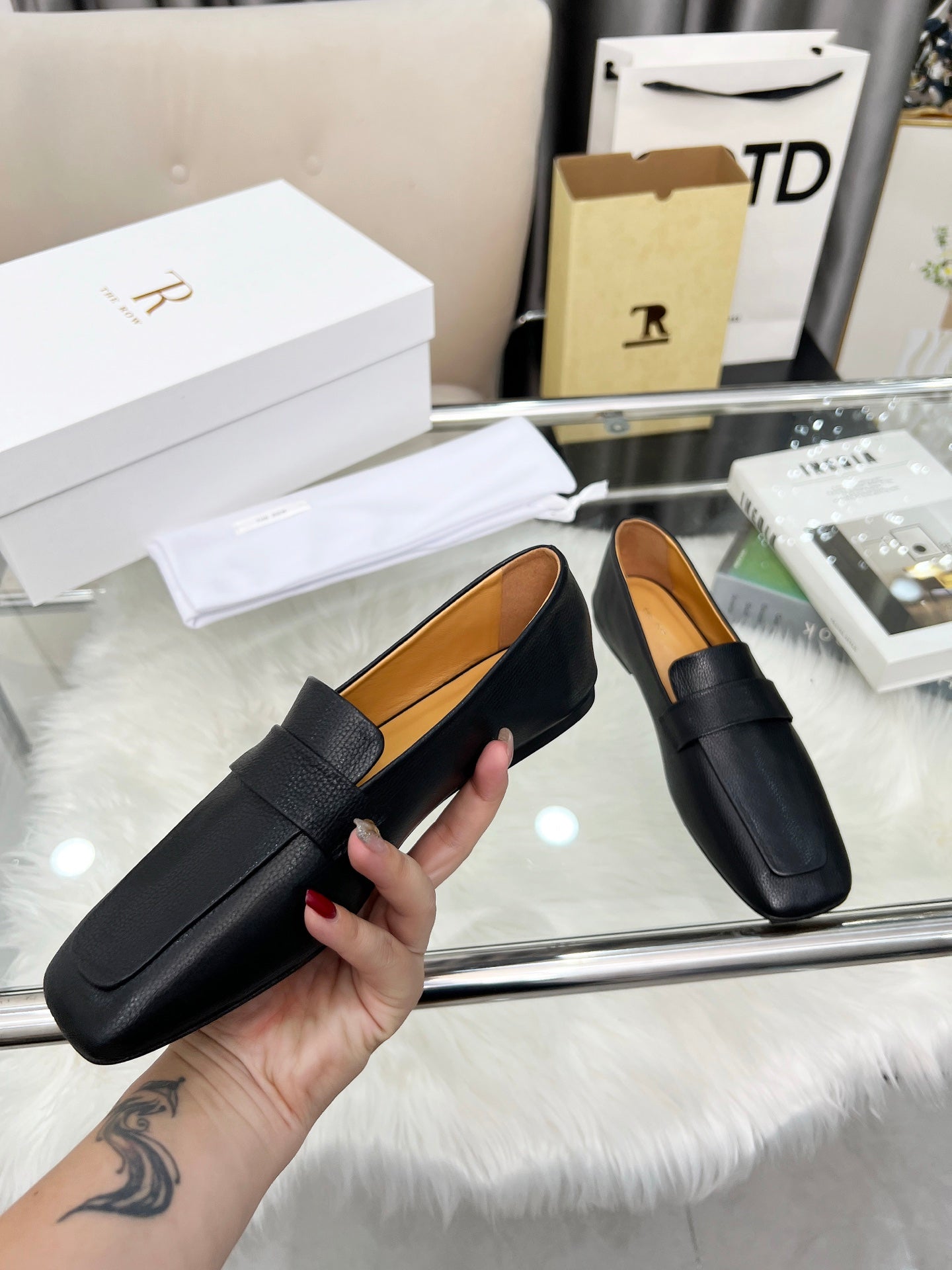 THE ROW 26S PENNY LOAFER FLATS IN BLACK GRAINED CALFSKIN