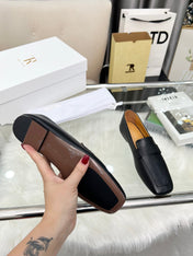 THE ROW 26S PENNY LOAFER FLATS IN BLACK GRAINED CALFSKIN