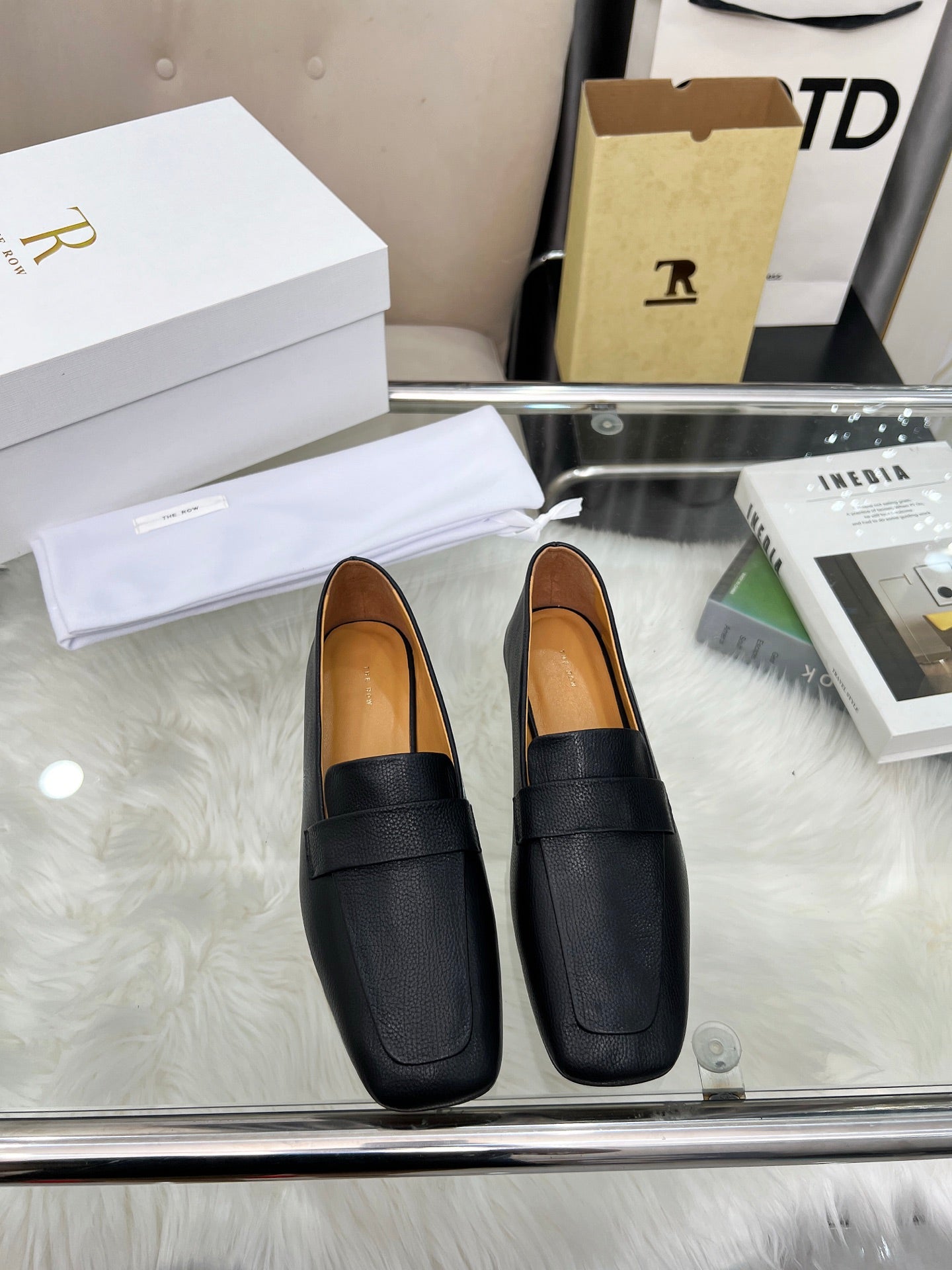 THE ROW 26S PENNY LOAFER FLATS IN BLACK GRAINED CALFSKIN