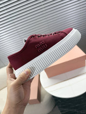 MIUMIU 26S PLATFORM SNEAKERS IN DARK RED CANVAS