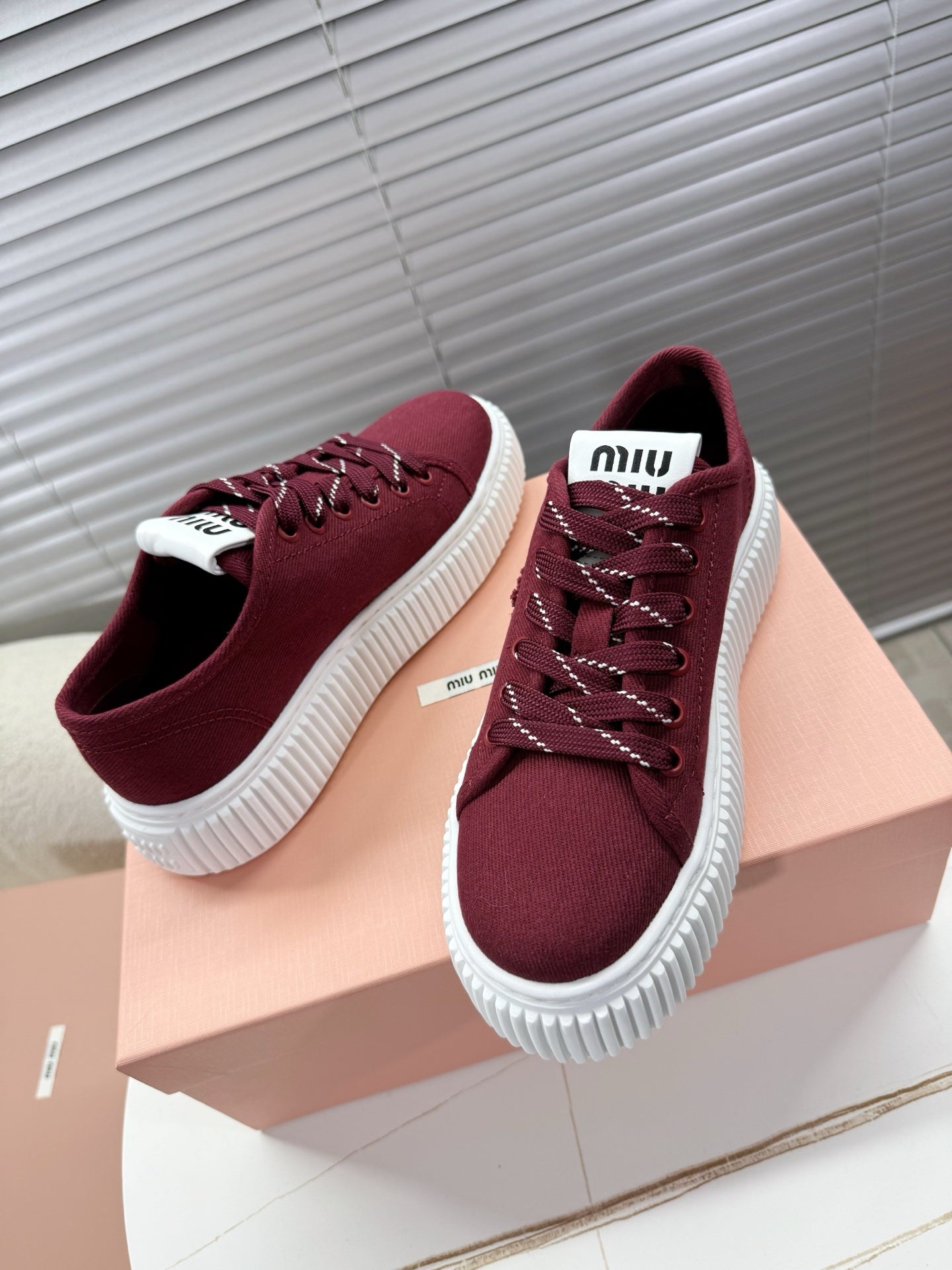 MIUMIU 26S PLATFORM SNEAKERS IN DARK RED CANVAS