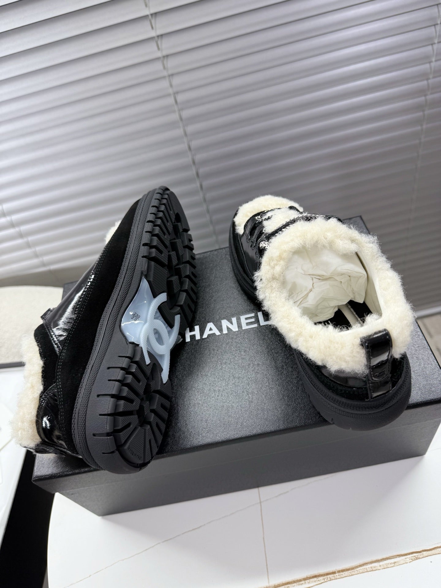 CHANEL 25S SNEAKERS WITH FUR ACCENTS 35MM IN BLACK CALFSKIN