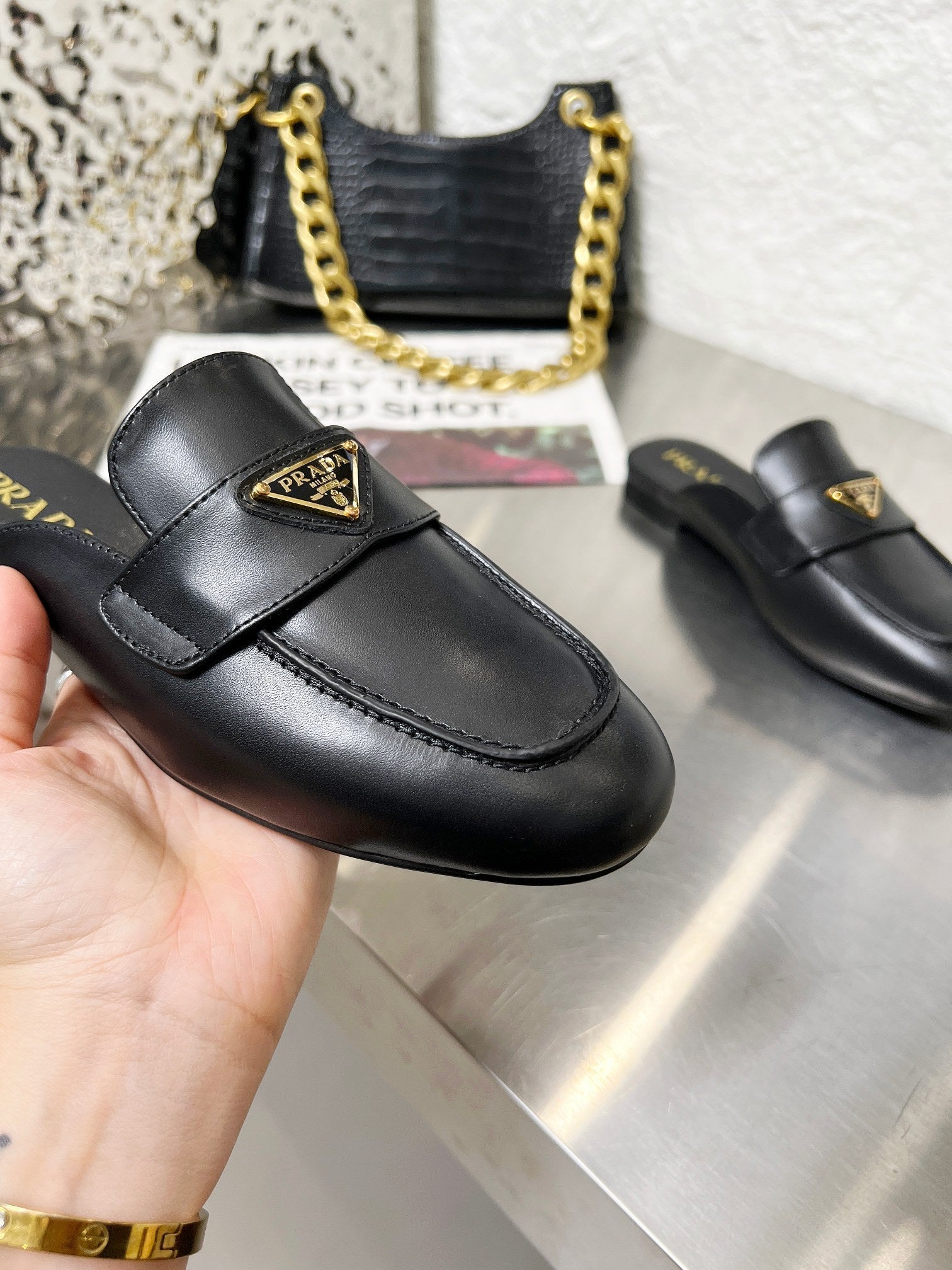 PRADA 26S MULE LOAFERS IN BLACK CALFSKIN WITH LOGO