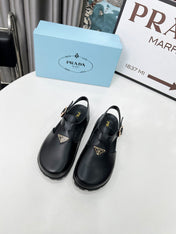 PRADA 26S RUBBER LOGO CHUNKY SOLE FISHERMAN SANDALS IN BLACK CALFSKIN