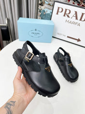 PRADA 26S RUBBER LOGO CHUNKY SOLE FISHERMAN SANDALS IN BLACK CALFSKIN