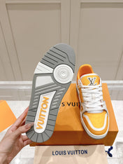 LV TRAINER SNEAKER IN SAFFRAN YELLOW GRAINED CALFSKIN