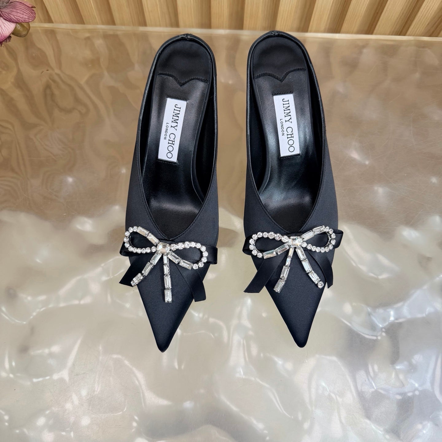 JIMMY CHOO 26S HIGH-HEELED MULES 65 MM IN BLACK SATIN WITH RHINESTONE BOW