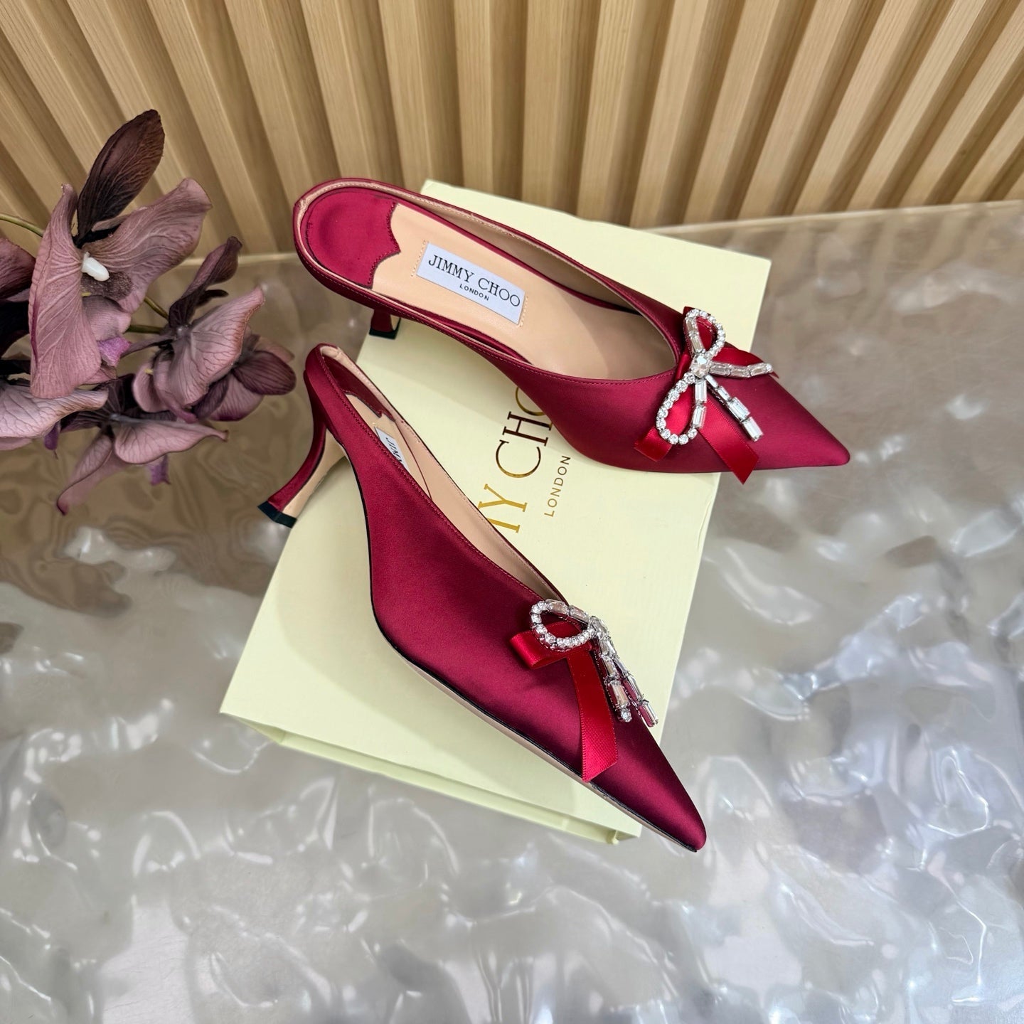 JIMMY CHOO 26S HIGH-HEELED MULES 65 MM IN RED SATIN WITH RHINESTONE BOW