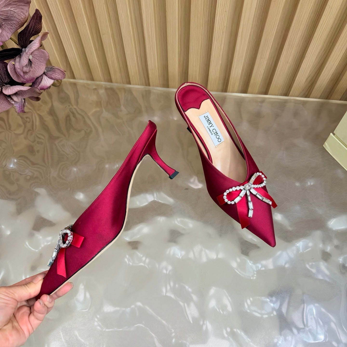 JIMMY CHOO 26S HIGH-HEELED MULES 65 MM IN RED SATIN WITH RHINESTONE BOW