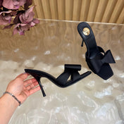 YSL 26S HIGH HEEL SANDALS 90 MM IN BLACK SILK WITH OVERSIZED BOW EMBELLISHMENT