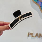 CHANEL 26S BARRETTE HAIR CLIP IN BLACK AND IVORY LEATHER 505338