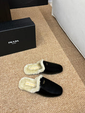PRADA 26S SHEARLING MULE SLIPPERS IN BLACK CALFSKIN